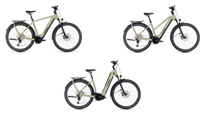 On peut voir trois vélos électriques Cube Kathmandu Hybrid blancs, chacun avec un cadre diamant, un cadre trapèze et un cadre à enjambement bas.  