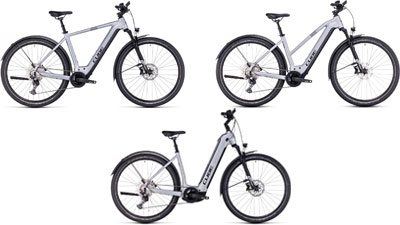 On peut voir trois vélos électriques blancs Cube Nuride Hybrid, chacun avec un cadre diamant, un cadre trapèze et un cadre à cadre bas.  