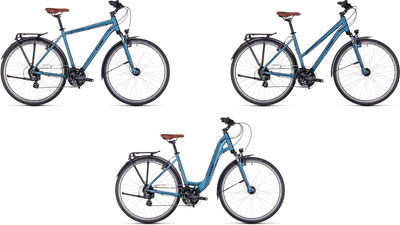 Trois vélos Cube Touring One côte à côte : un avec un cadre diamant, un avec un cadre trapèze et un avec un cadre bas.